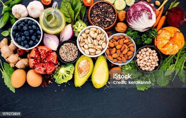 Ingredients For The Healthy Foods Selection The Concept Of Healthy Food Set Up On Dark Stone Background Stock Photo - Download Image Now