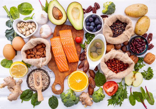 ingredients for the healthy foods selection on white background. balanced healthy ingredients of unsaturated fats and fiber for the heart and blood vessels. - carotene imagens e fotografias de stock