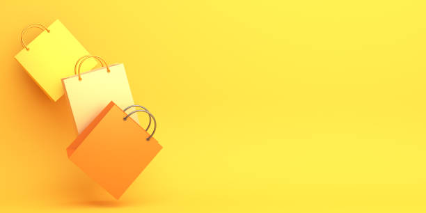 istock Empty orange color shopping bag on the yellow background, copy space text, Design creative concept for halloween day or autumn sale event. 1179274432