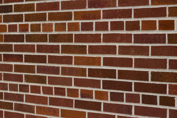 istock Traditional dark brown vintage brick wall texture background (angle view) 1179277212