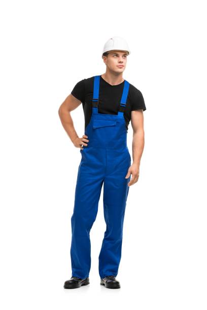 istock Man in blue work overolls and helmet view 1179284226