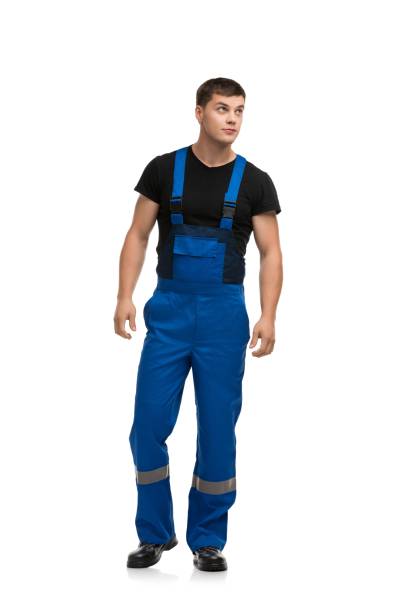 istock Man in blue work overolls isolated rearview 1179284285