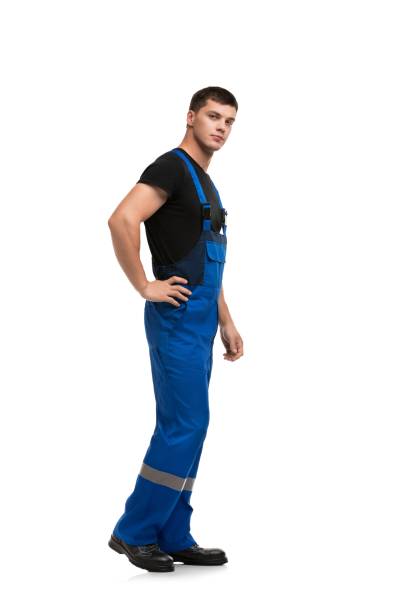istock Man in work overolls isolated rearview 1179284291
