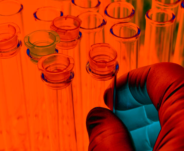 istock Test tubes: artistic, hand holding test tube 1179287774