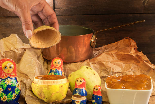 istock Imaginary fruit genetic modification of a quince that opens like a Russian doll and is already ready to use in the form of jam - still life with organic fruit jam pan and dolls 1179287811
