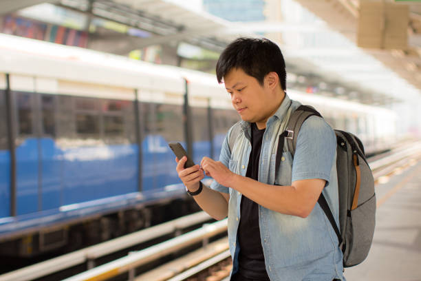 istock Local traveller using mobile app to help out his travel journey 1179291623