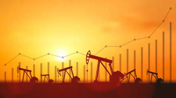 Vector illustration of Up trend line graph and Silhouette Oil pumps at oil field with sunset sky background