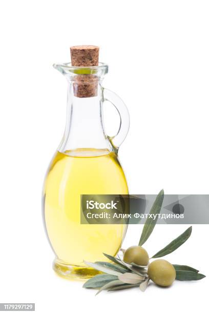 Olive Oil In A Glass Bottle Fresh Olives And Olive Branch Isolated White Background Stock Photo - Download Image Now