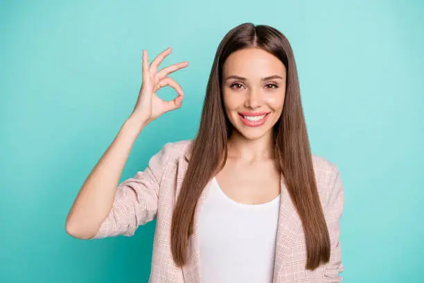 Close-up portrait of her she nice-looking attractive lovely content cheerful straight-haired, girl showing ok-sign ad advert isolated over bright vivid shine blue green teal turquoise background