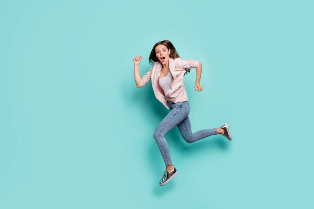 Full length body size view of her she nice-looking pretty attractive cheerful straight-haired lady storming running fast isolated over bright vivid shine blue green teal turquoise background Full length body size view of her she nice-looking pretty attractive, cheerful straight-haired lady storming running fast isolated over bright vivid shine blue green teal turquoise background storming stock pictures, royalty-free photos & images