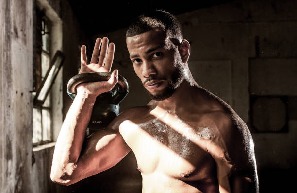 istock Portrait of a Young Man Exercising With Weights 1179301053