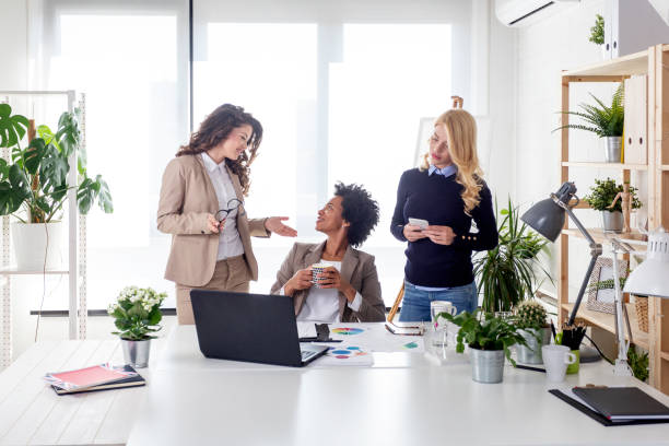 istock Three multiethnic business woman at the office work on project 1179302376
