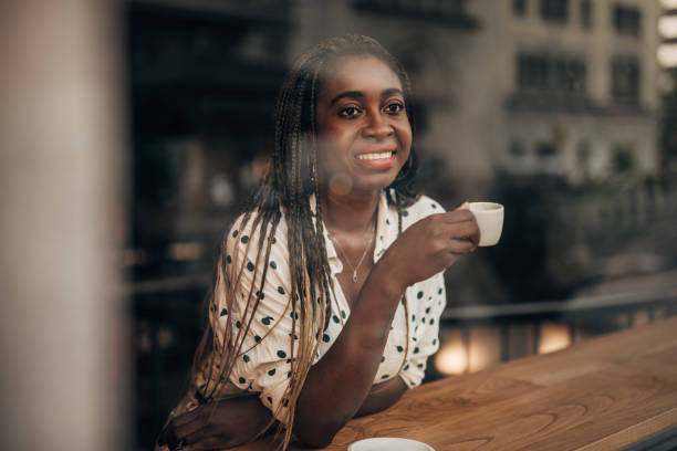 istock Young woman drinking coffee at the cafe 1179302920
