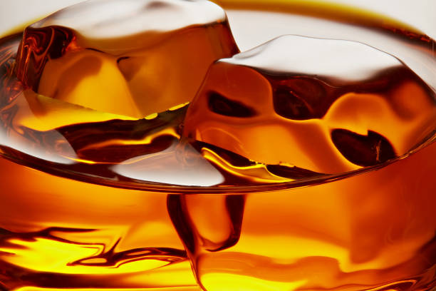 istock Glass of elegant whiskey with ice cubes 1179304966