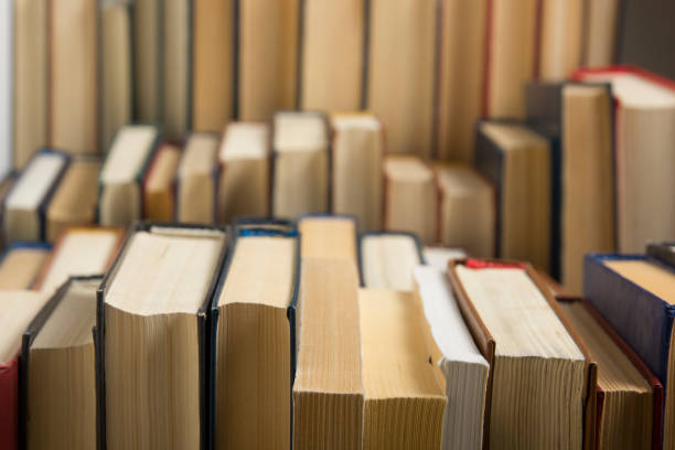 istock Open book, hardback books on wooden table. Back to school. Copy space 1179306089