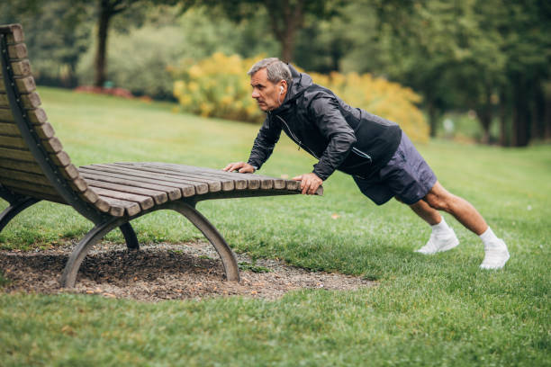 istock Man exercising after jogging in park 1179310329