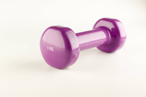 istock one kilogram purple dumbbells 1179310509