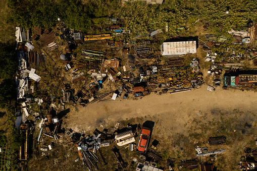 Scrap metal junkyard area aerial view. Reception and storage metal waste before recycling