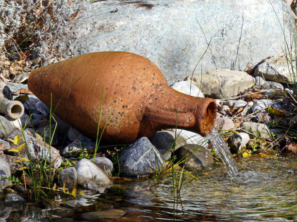 Early Autumn. Amphora as a water source at the pond edge.