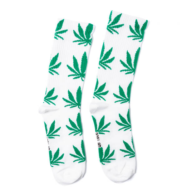 istock white and black  socks with 
with hemp or cannabis on it in the white isolated background 1179311601
