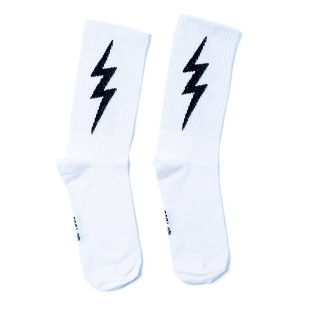 white and black  socks with lightning on it in the white isolated background