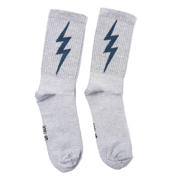 istock white and black  socks with lightning on it in the white isolated background 1179311609