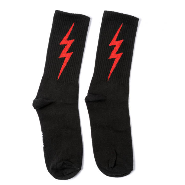 istock white and black  socks with lightning on it in the white isolated background 1179311617