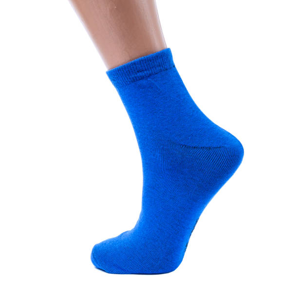 istock blue socks on an isolated white background with funny cartoon character on it 1179311713