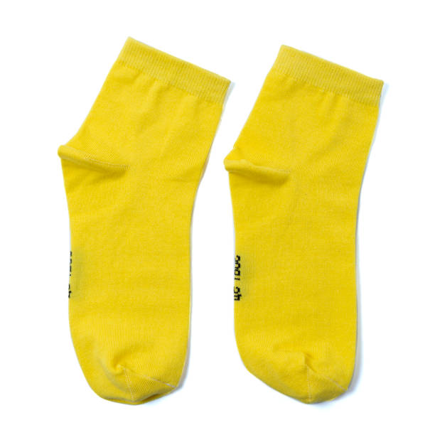 istock pair of yellow socks on an isolated white background 1179311727