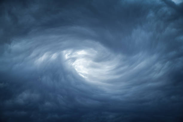 istock The eye of a tornado starts to create a vortex from grey couds 1179313233