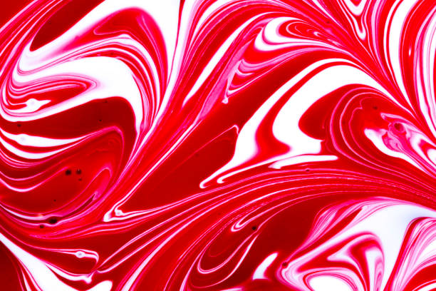 istock Red and white paint swirls 1179316518