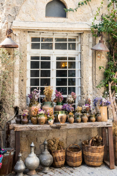 Pots, plants, baskets and other containers on a table outside a shop in Alacati,Izmir, Turkey
