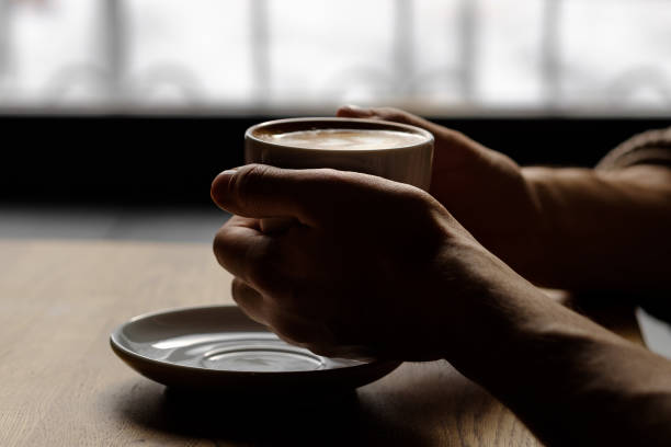 istock a cup of coffee in the hands. soft light 1179321215