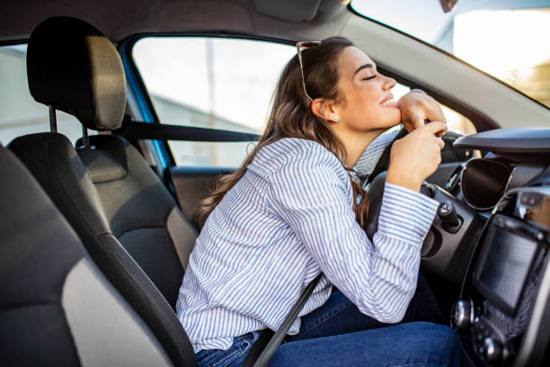 istock Young Woman Embracing Her New Car. 1179322093