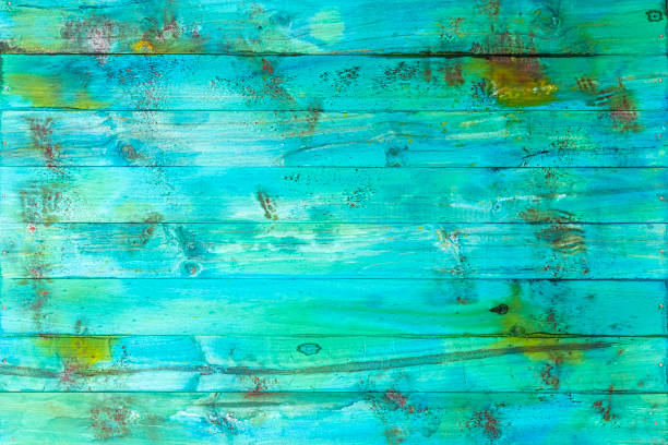 istock Distressed, worn, weathered, old, blue and white, turquoise-colored wooden panel abstract background. 1179323456