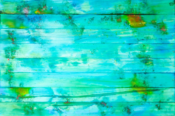 istock Distressed, worn, weathered, old, blue and white, turquoise-colored watercolor on a wooden panel abstract background. 1179323458