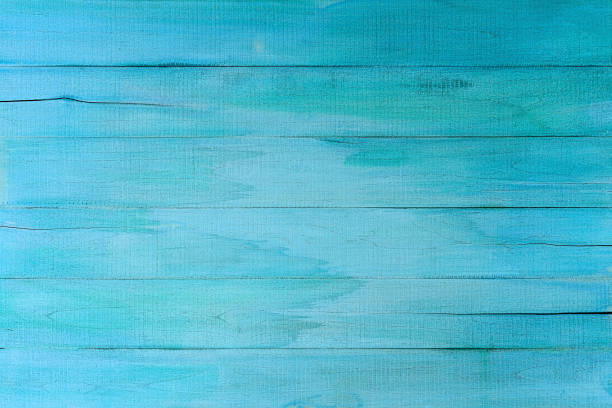 istock Distressed, worn, cracked, weathered, old, blue wooden panel abstract background. 1179323459