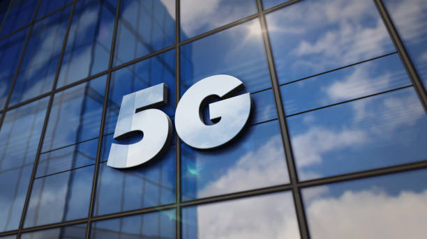 istock 5G mobile communication symbol on glass wall and mirrored building 1179324838