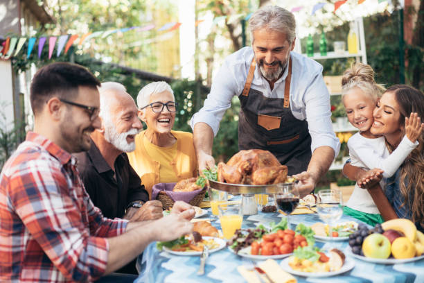 istock Happy family celebrating Thanksgiving day 1179326056