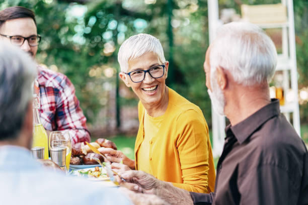 istock Happy family having lunch outdoor 1179326071
