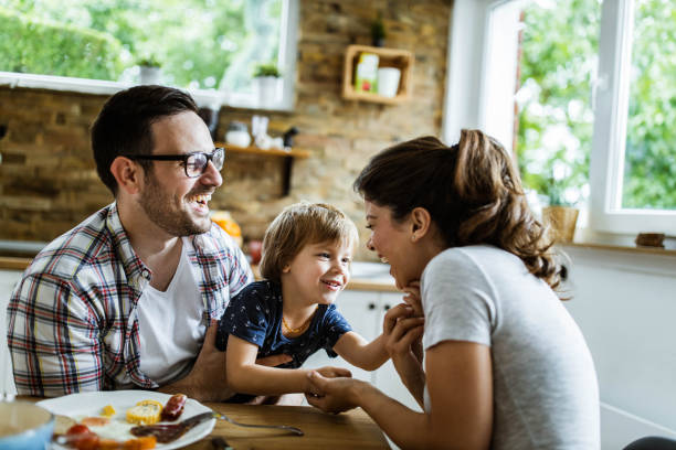 istock Happy family having fun during breakfast in dining room. 1179326876
