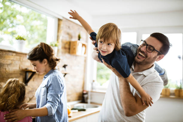 istock Happy boy having fun with his father in the kitchen. 1179328663