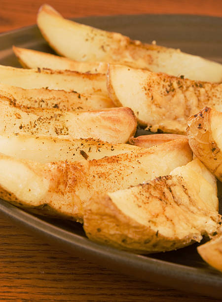 istock Seasoned Potato Wedges Close Up 117933211