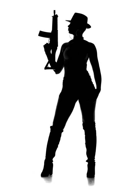 istock Sexy Female Gangster Silhouette 1179333143