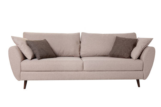 istock Modern grey fabric sofa with pillows isolated on white background. Strict style furniture 1179334353