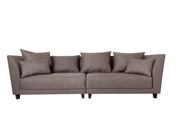 istock Modern grey fabric sofa with pillows isolated on white background. Strict style furniture 1179334369