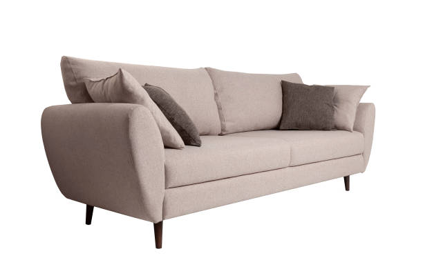 istock Modern grey fabric sofa with pillows isolated on white background. Strict style furniture 1179334378
