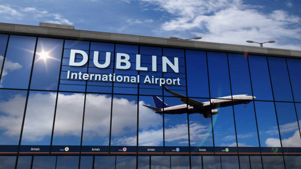 istock Airplane landing at Dublin mirrored in terminal 1179334644