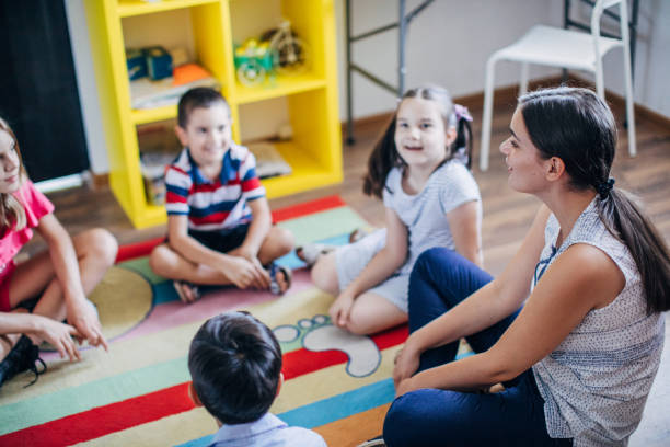 istock Teacher and preschoolers 1179335927