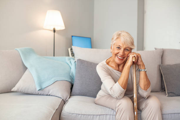 istock Pleasant thoughtful aged woman seating with a walking stick. 1179336839